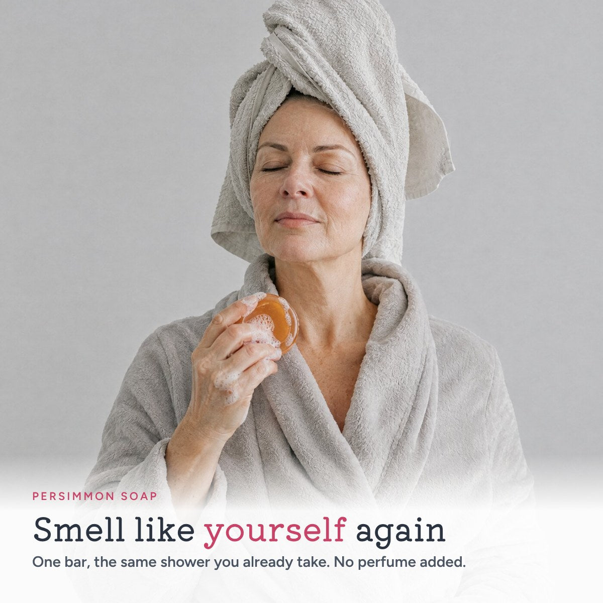 Smell like yourself again: woman holding the persimmon soap bar